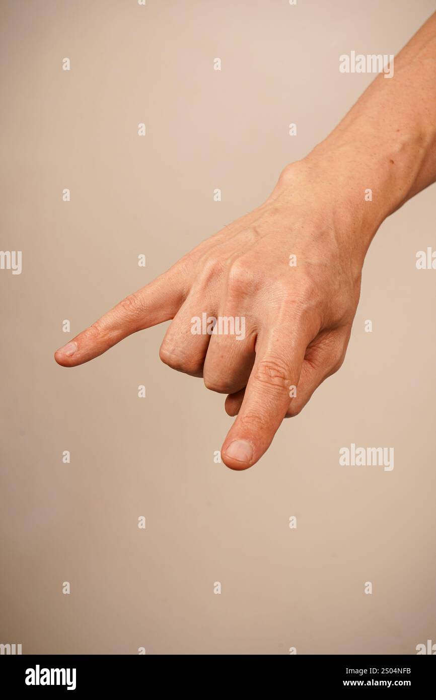 A hand makes the iconic rock 'n' roll 