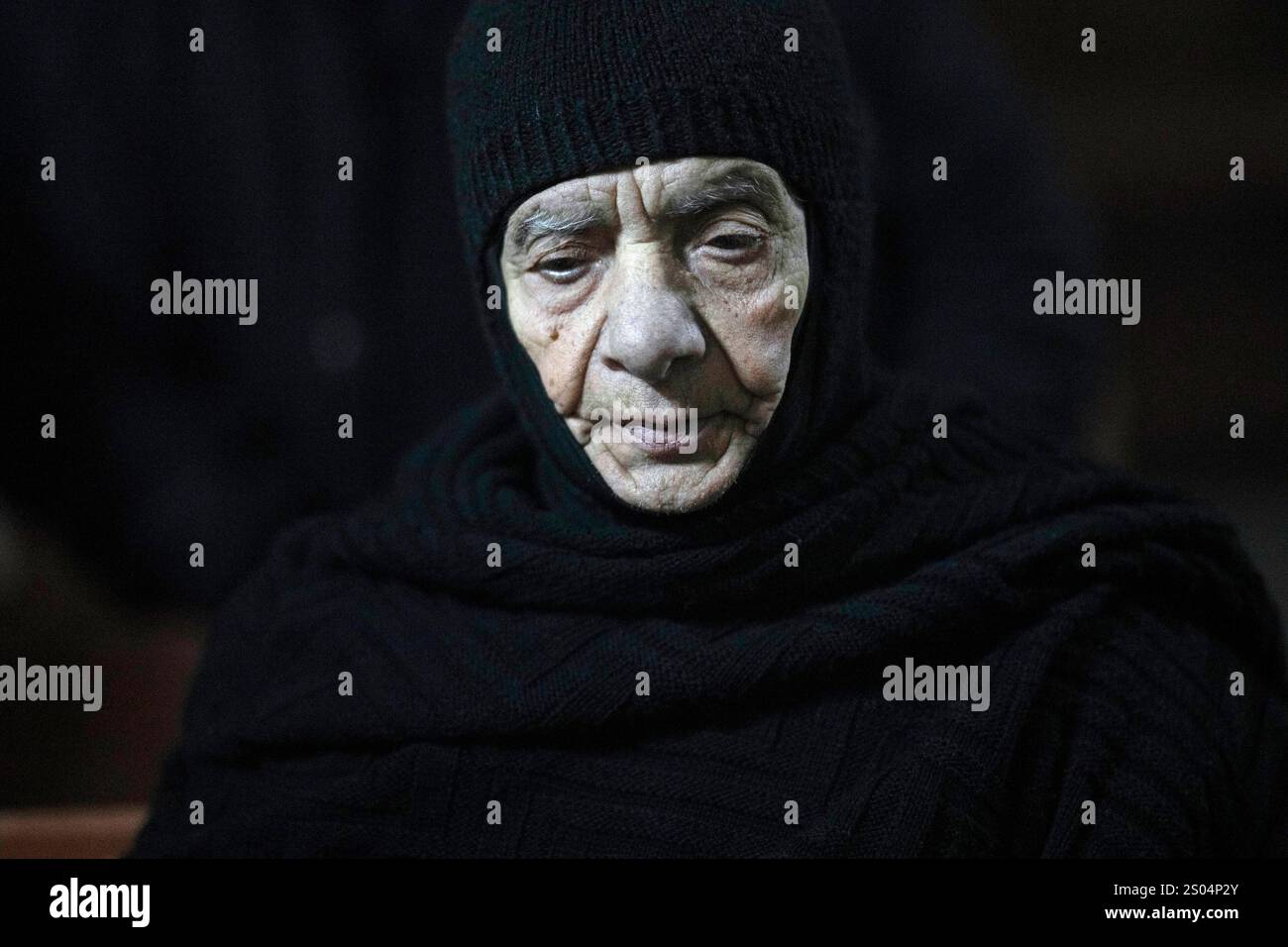 A nun attends the Christmas mass in the Greek Orthodox convent Saint