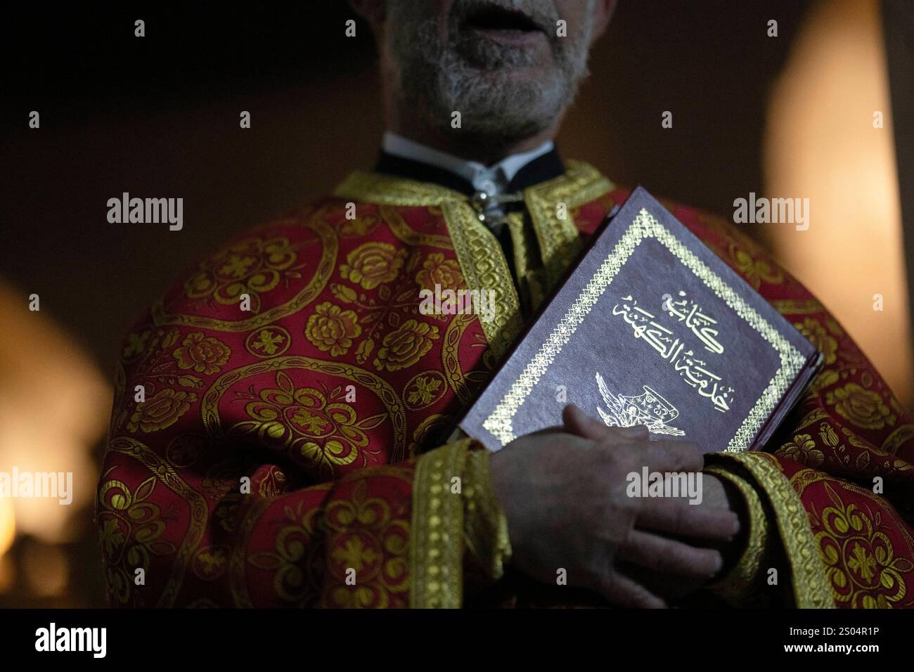 Priest Abuna Mata attends the Christmas mass in the Greek Orthodox