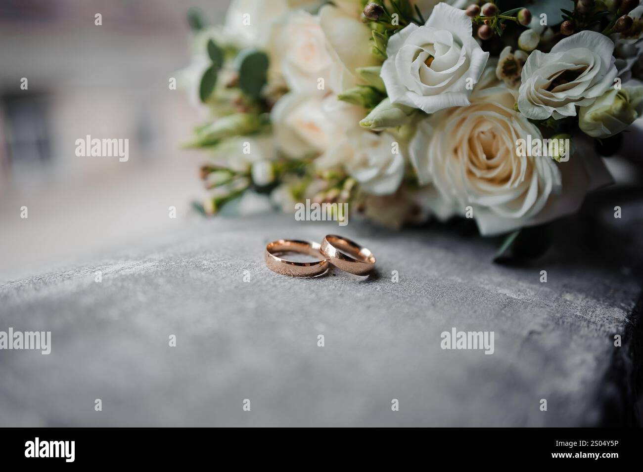 Elegant Wedding Rings Beside a Beautiful Floral Bouquet Stock Photo - Alamy
