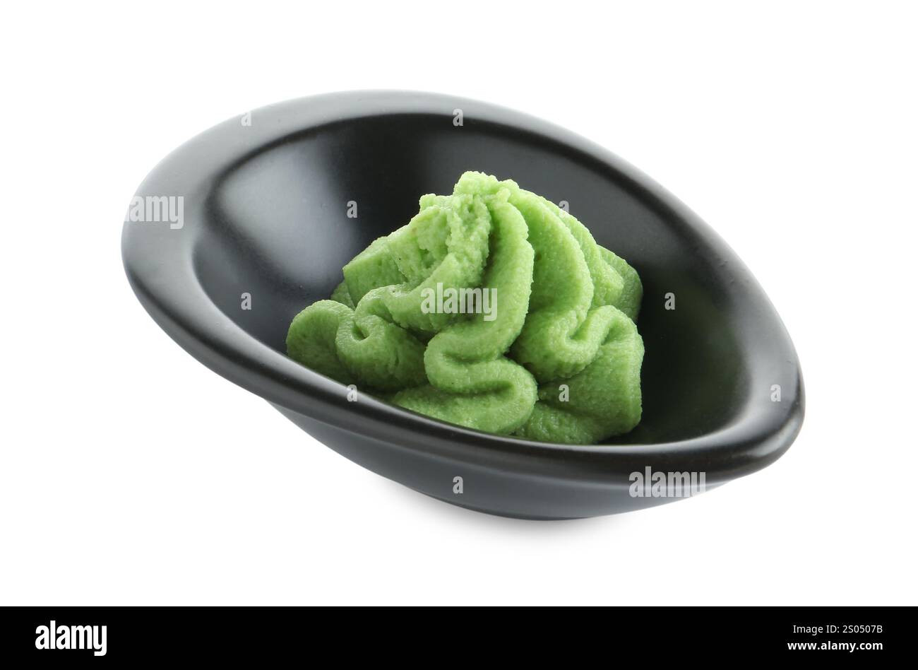 Hot wasabi paste in gravy boat isolated on white Stock Photo