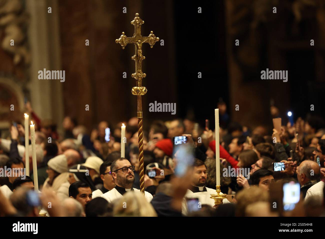 Vatican City, Italy 24.12.2025 The cross enters the in St. Peter's