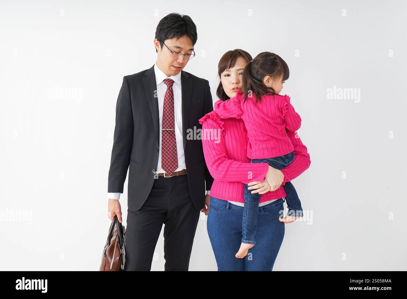 Father and mother and daughter going to work Stock Photo - Alamy