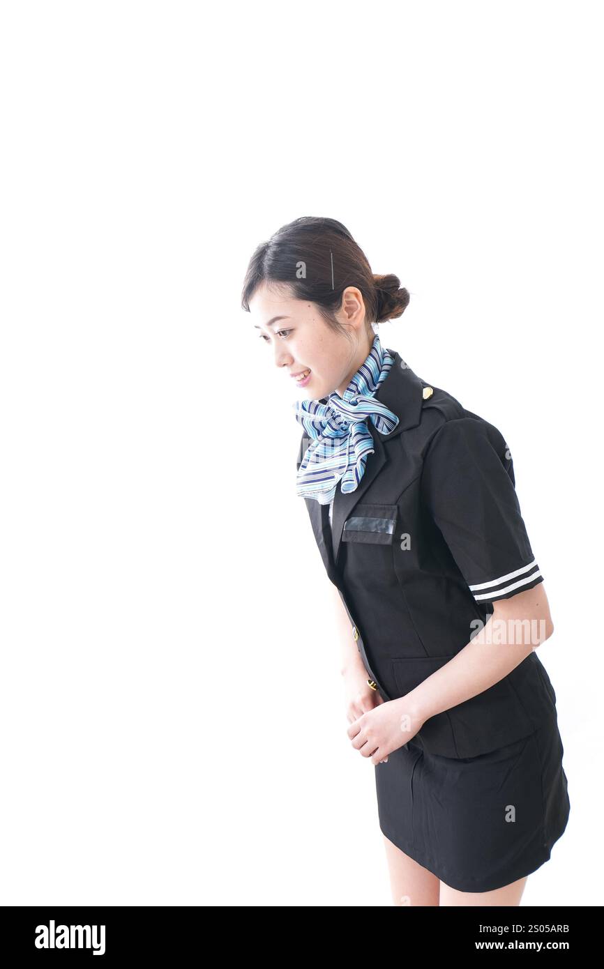 Cabin attendant bowing Stock Photo