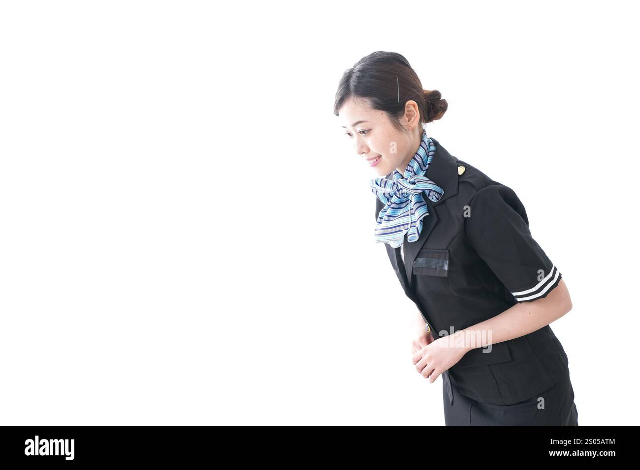 Cabin attendant bowing Stock Photo