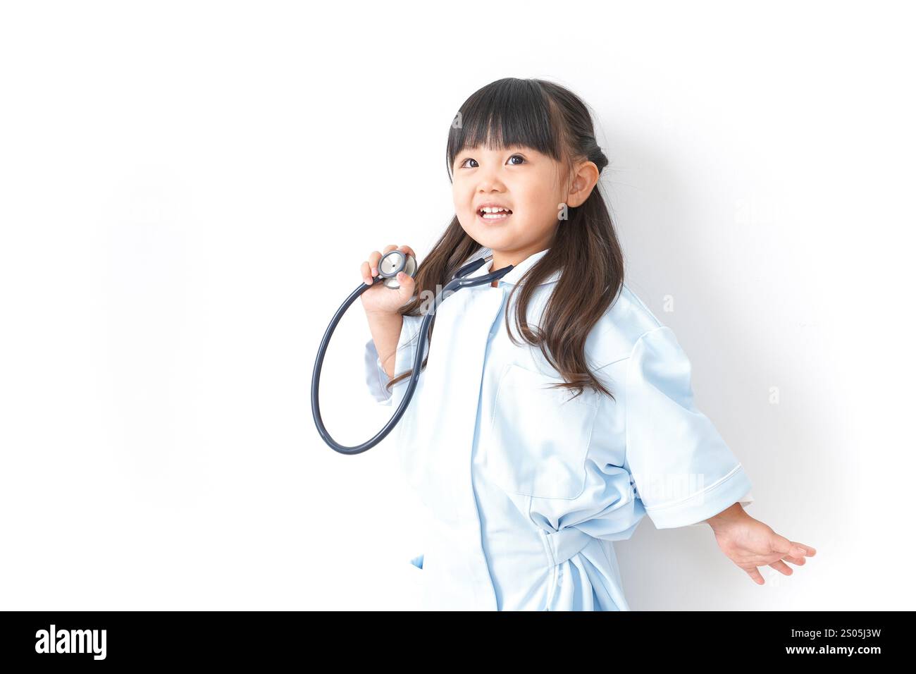 Girl playing nurse Stock Photo - Alamy