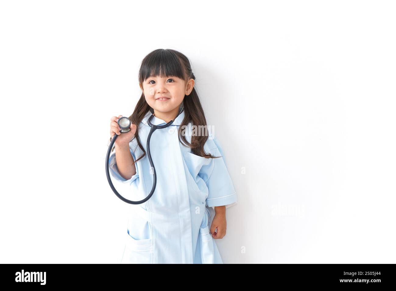 Girl playing nurse Stock Photo - Alamy