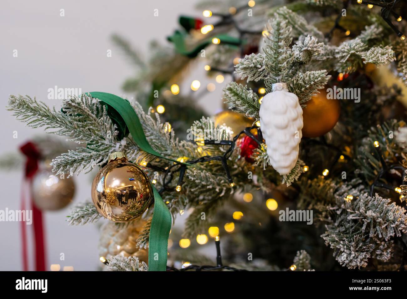This is a detailed closeup view of a beautifully adorned Christmas tree ...