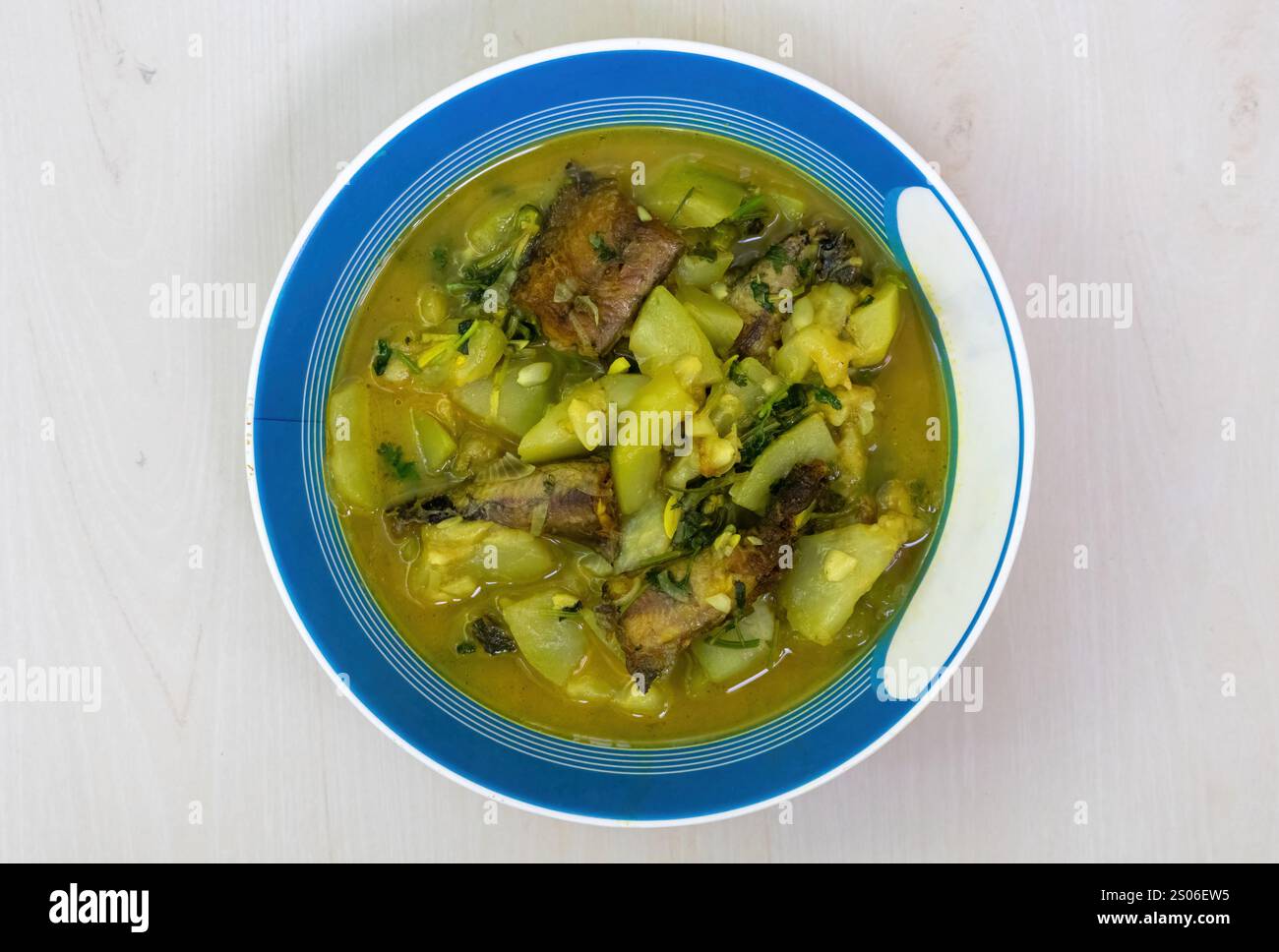 A bowl of cooked shing fish curry with gourd. Shing mach is a popular ingredient in Bangladeshi cuisine, prized for its health benefits, delicious tas Stock Photo