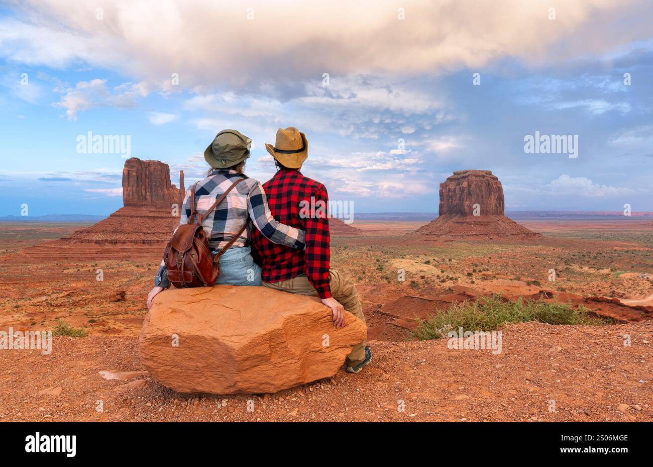 Young couple enjoying sunset view of Monument Valley National Park. Stock Photo