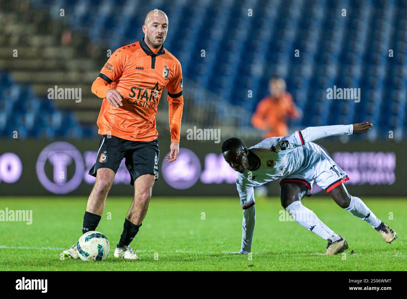 Steve De Ridder (6) of KMSK Deinze and Saliou Faye (10) of FC Seraing