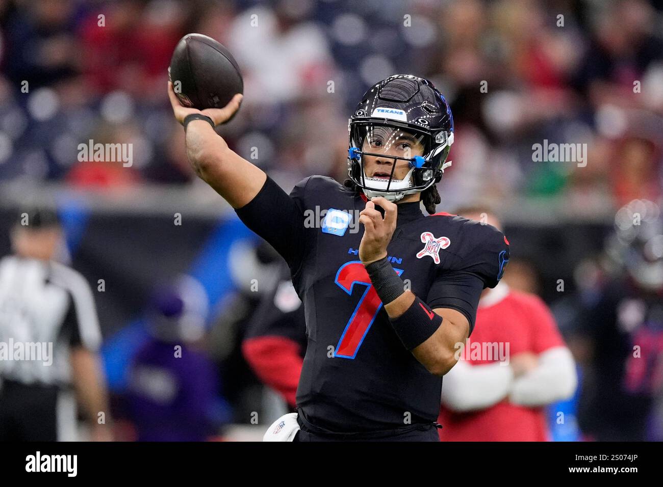 Houston Texans quarterback C.J. Stroud warms up before an NFL football