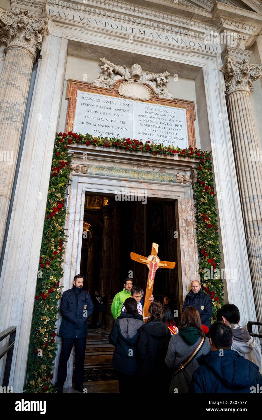 Faithful walk through the Holy Door of St. Peter's Basilica at the