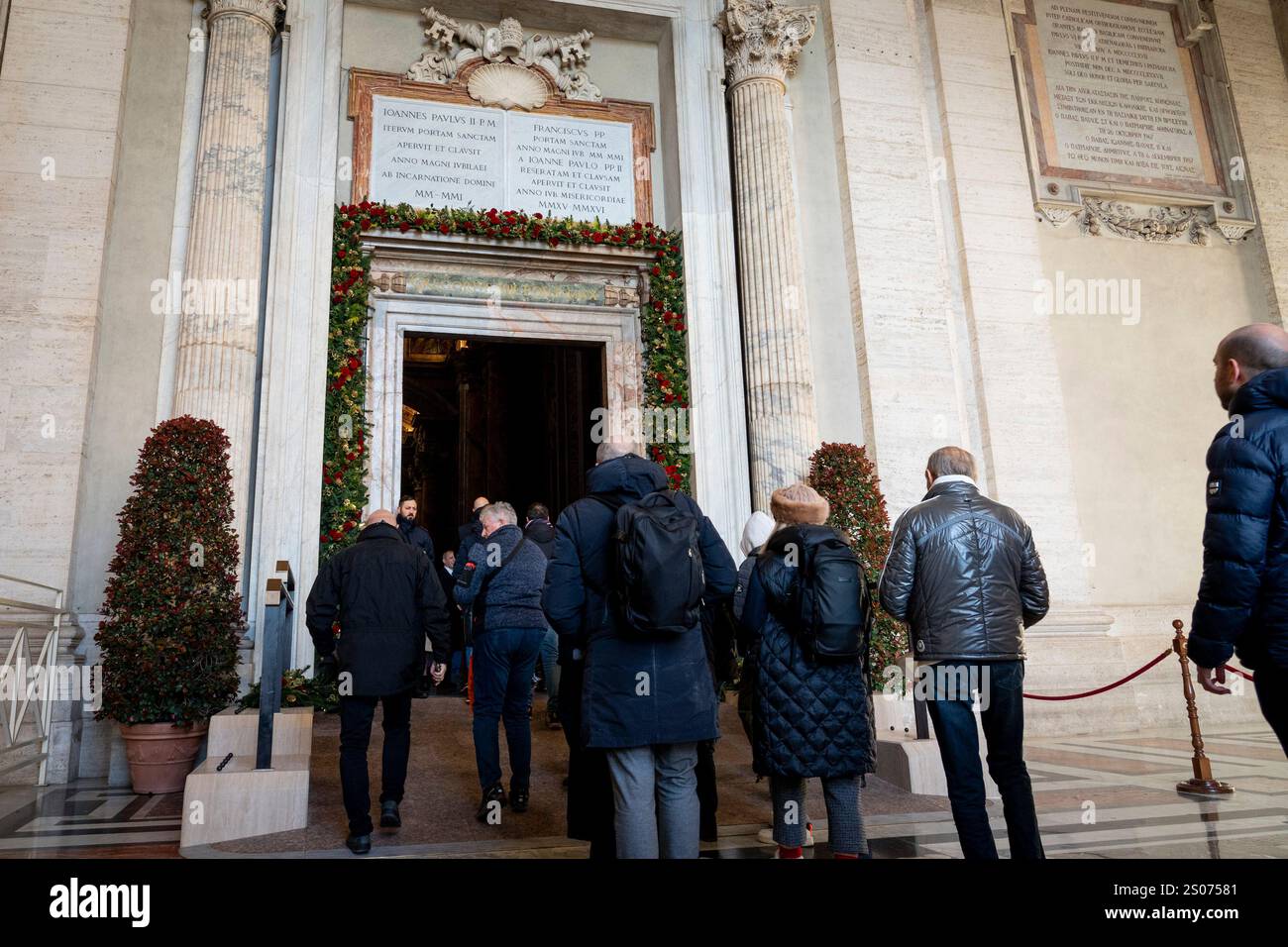 Faithful walk through the Holy Door of St. Peter's Basilica at the