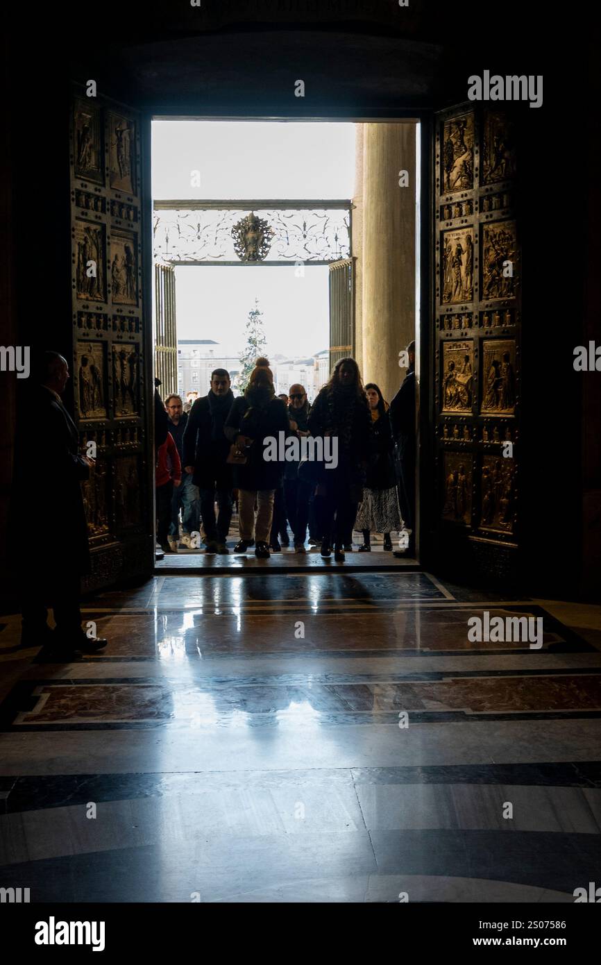 Faithful walk through the Holy Door of St. Peter's Basilica at the