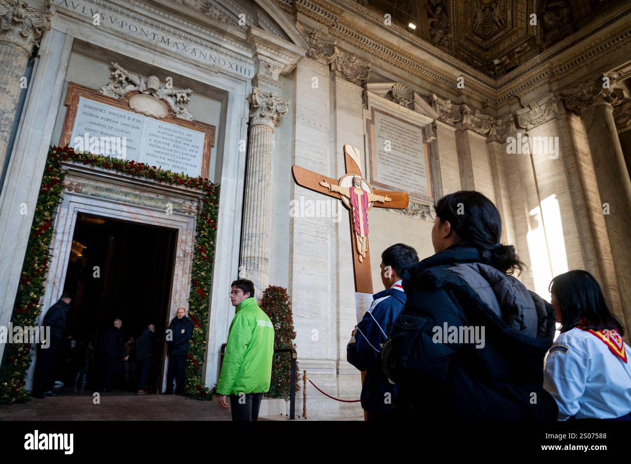 Faithful walk through the Holy Door of St. Peter's Basilica at the
