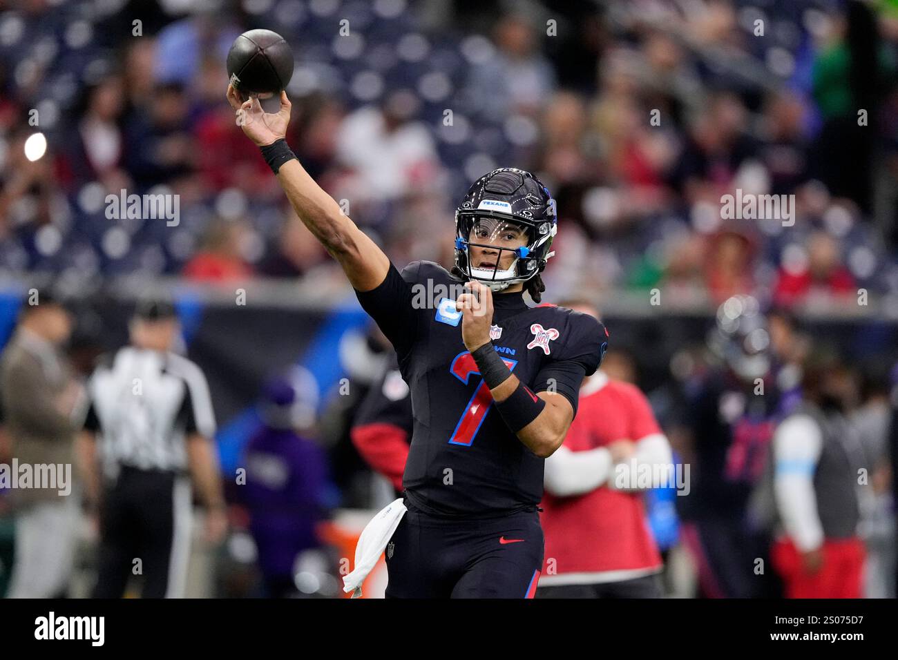 Houston Texans quarterback C.J. Stroud warms up before an NFL football
