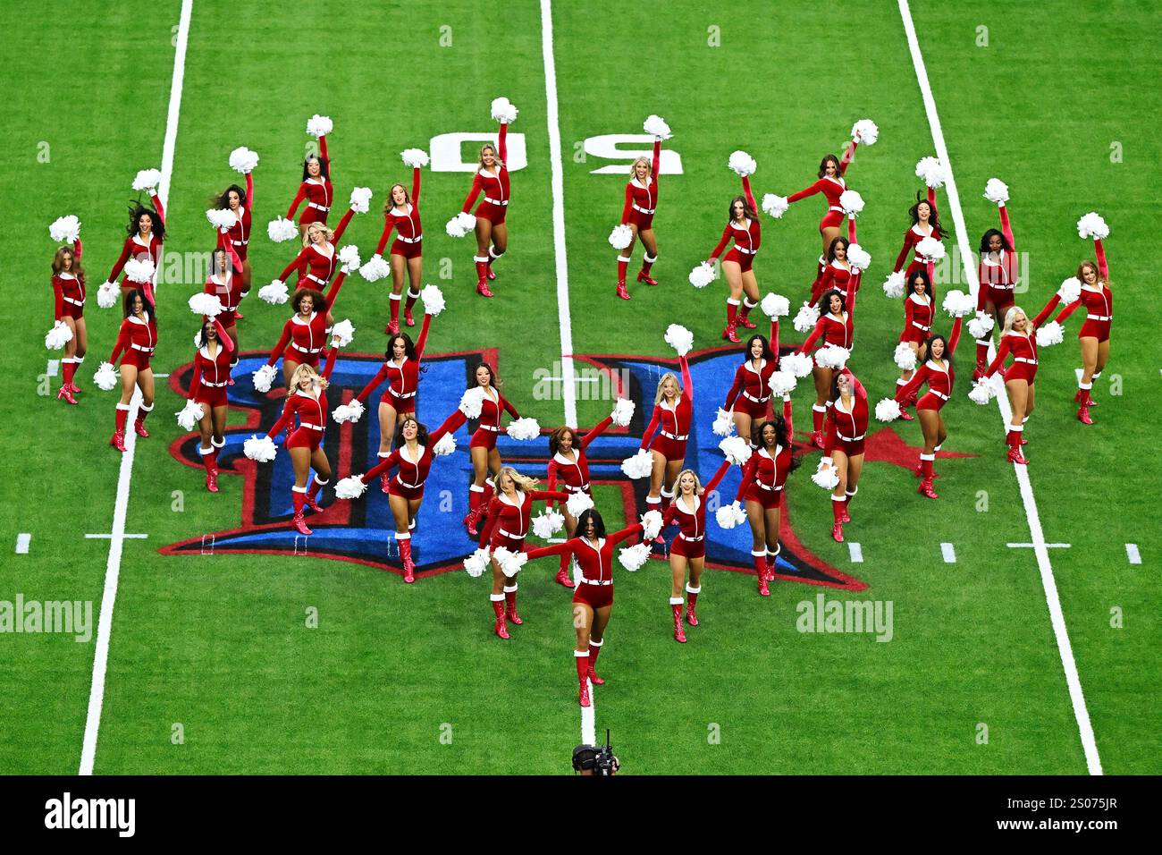 Cheerleaders dance in Santa costumes before the Baltimore Ravens take