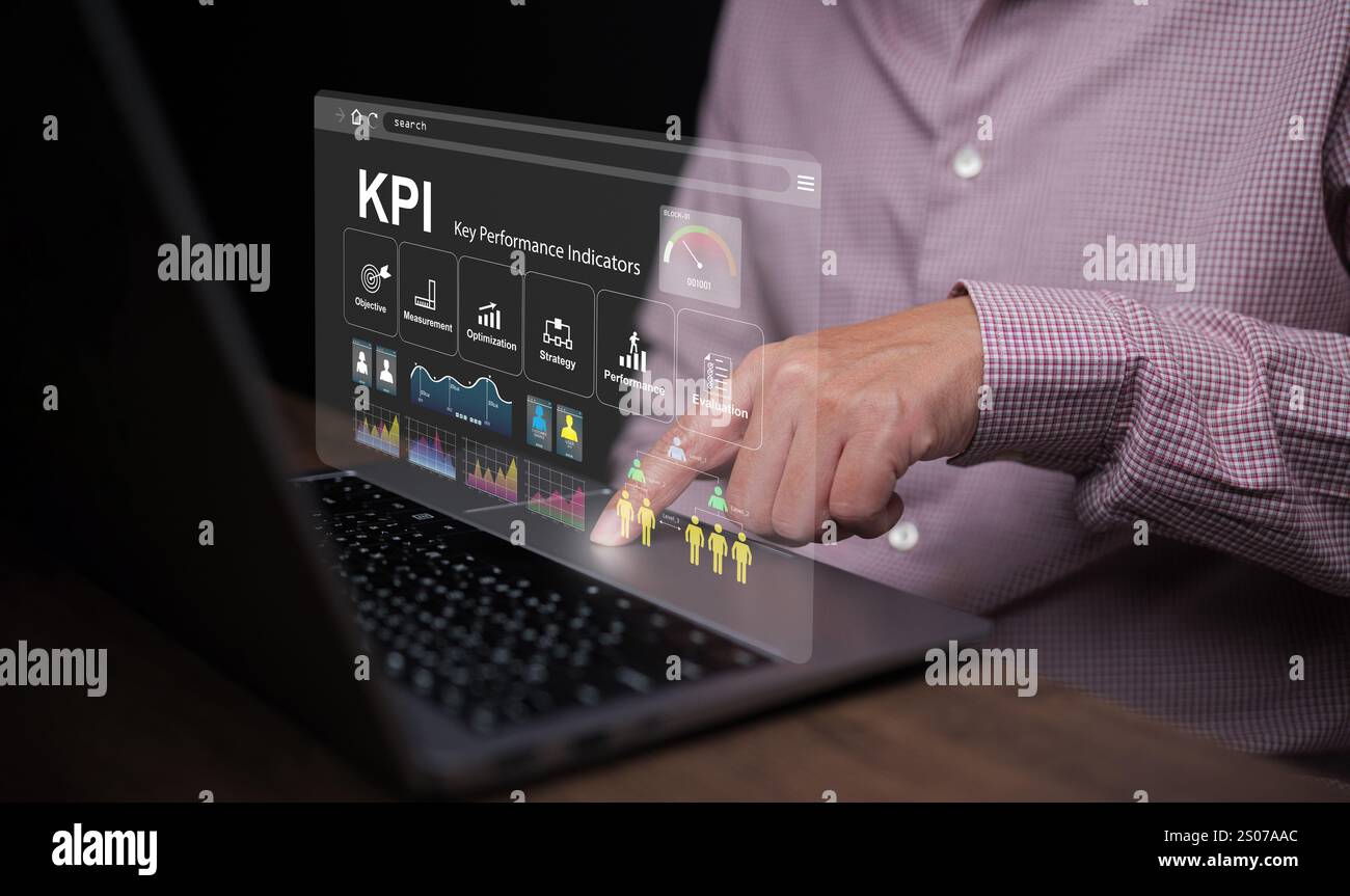 KPI key performance indicator. A businessman with a notebook computer uses KPIs to measure progress of his business, project, or work over time to rea Stock Photo