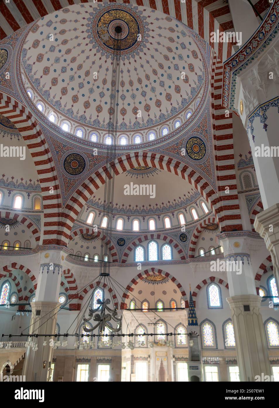 Beautiful arches, domes, and intricate handpainted artwork decorating the interior of the Ertugrul Gazi or Azadi Mosque in Ashgabat, Turkmenistan. Stock Photo