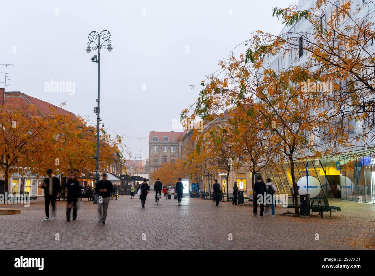 Zagreb, Croatia, October 31 2024: Citizens and tourists walking on trg Europe square in Zagreb Croatia , during a cloudy autumn day Stock Photo