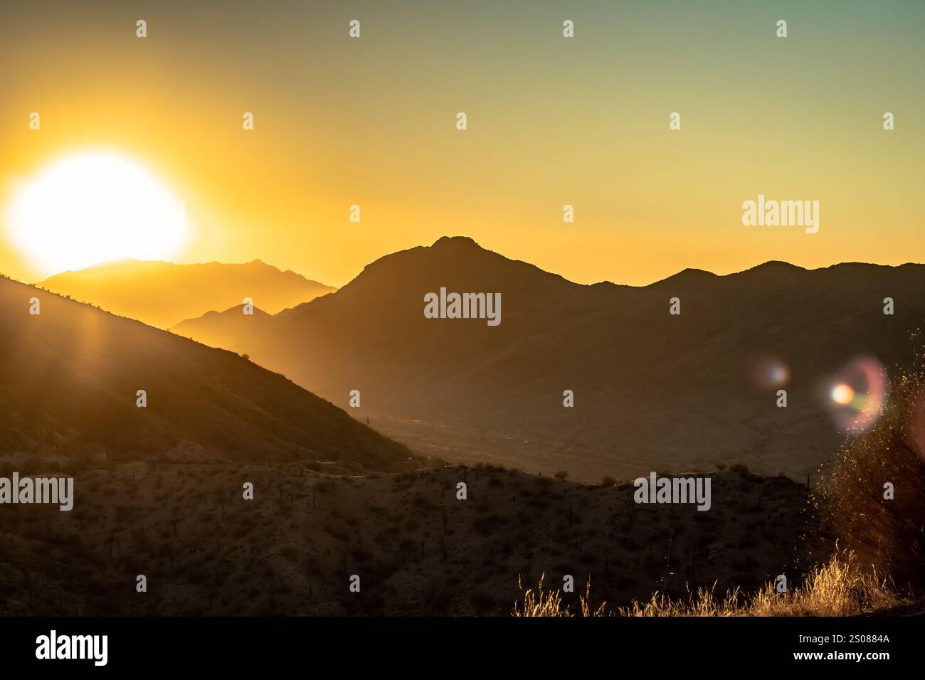 Yellow sunset in the Phoenix Arizona Sonoran Desert mountains. Photo ...
