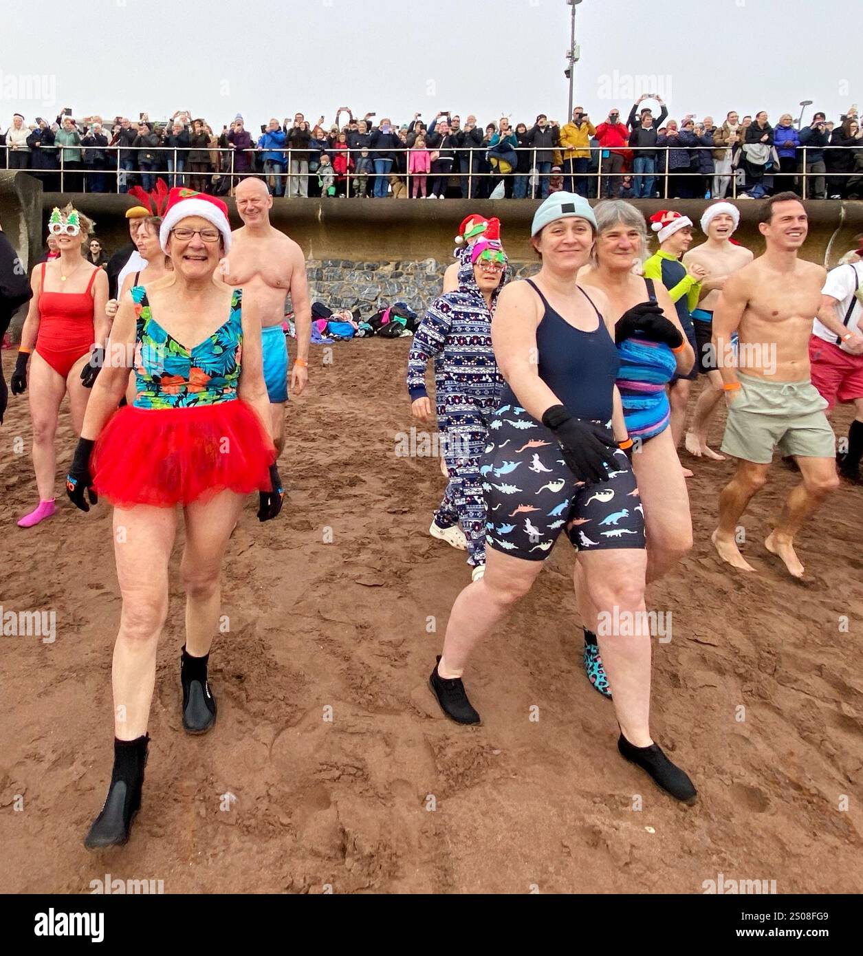 Teignmouth, Devon, UK. 26th December, 2025. Boxing Day dip. Teignmouth