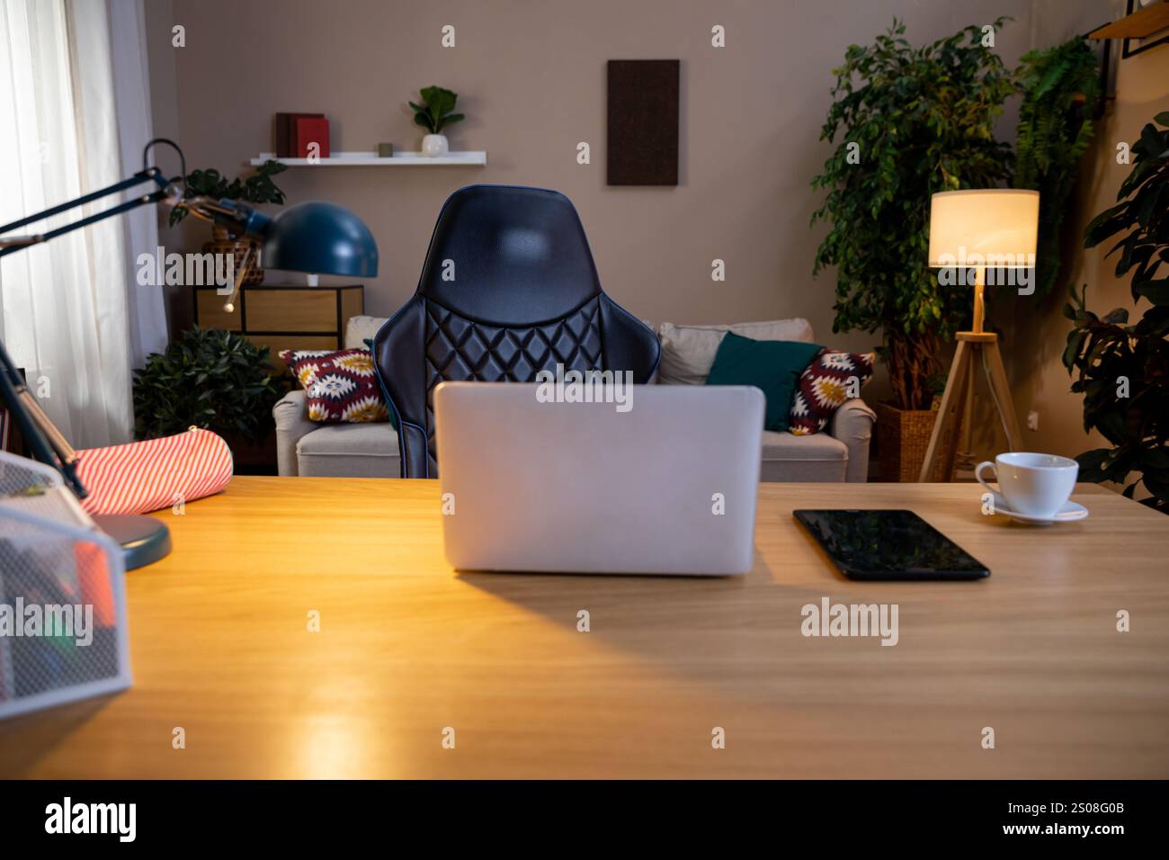 Explore a unique workfromhome setup featuring a vibrant and creative decor style that inspires Stock Photo