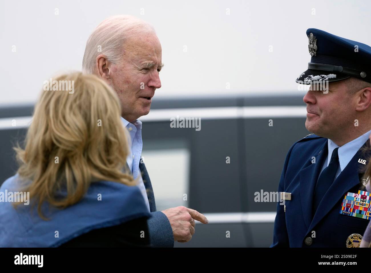 President Joe Biden and first lady Jill Biden, left, talk with Col ...
