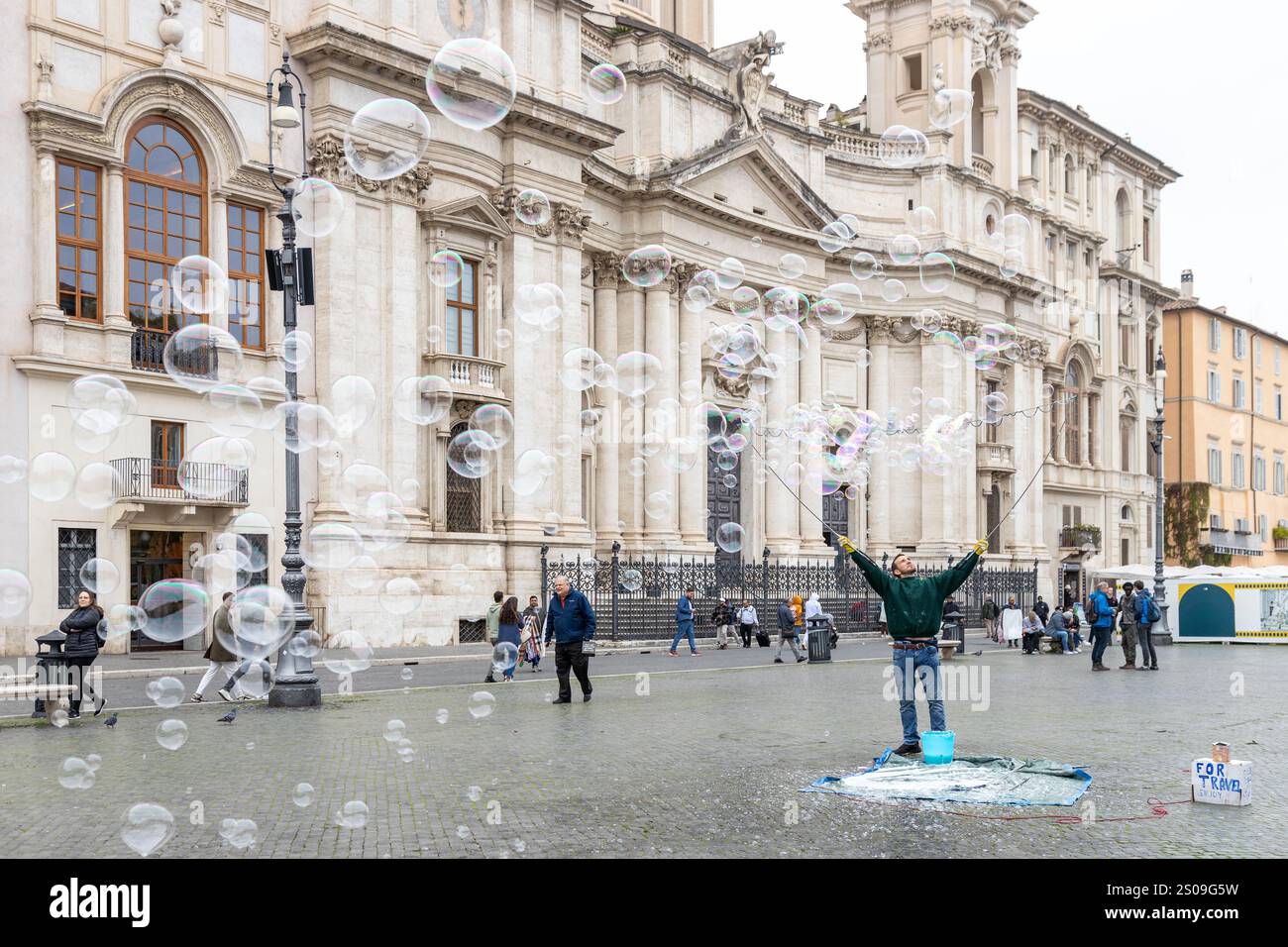Rome, Italy - Nov 14th, 2024: A performer creates giant soap bubbles in ...