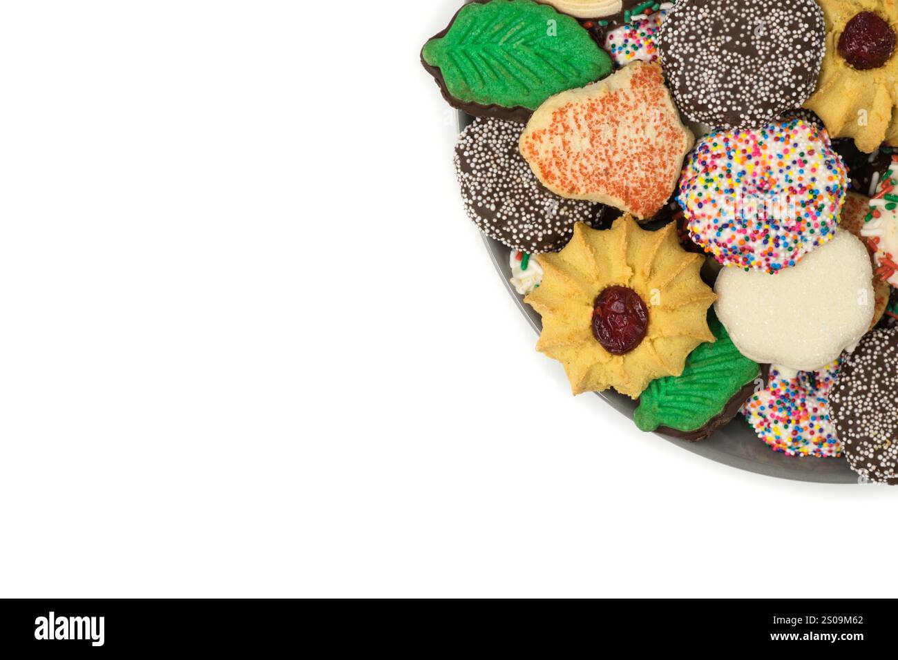 Christmas cookies assorted shortbread partial plate snacks white background copy space. Stock Photo