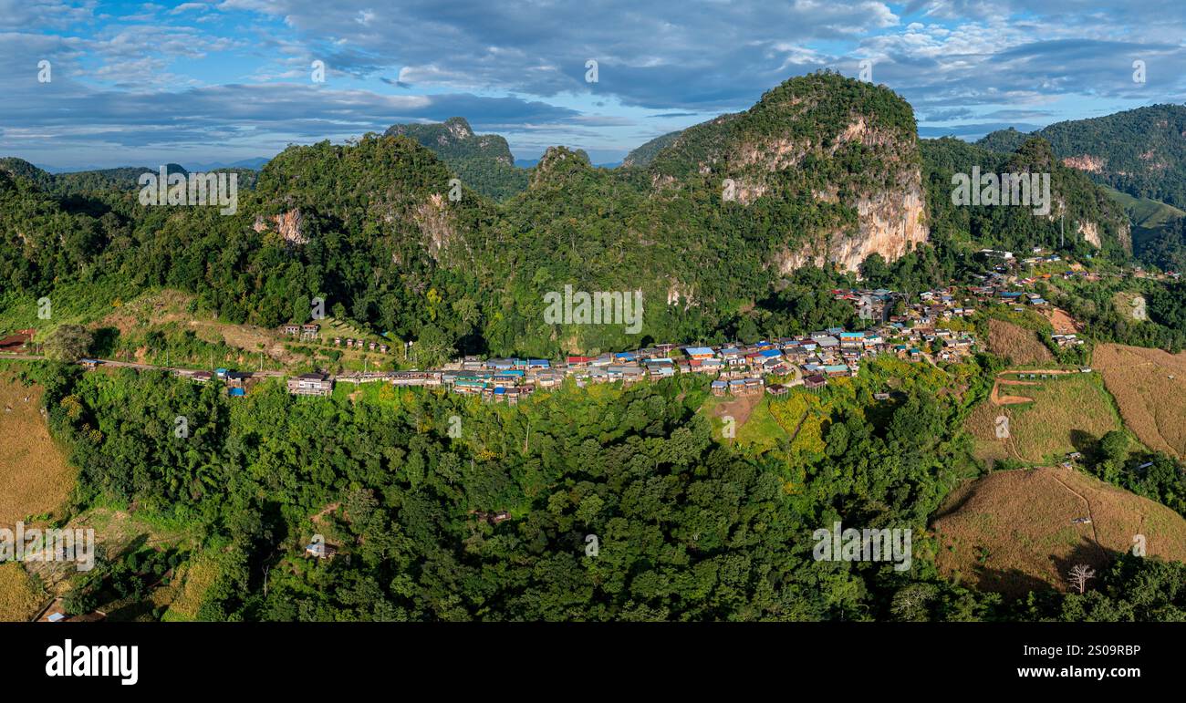 A breathtaking aerial view of a mountain village bathed in early ...