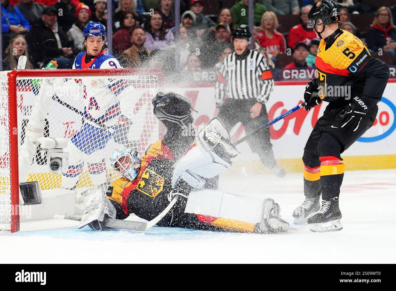 Germany goaltender Nico Pertuch (1) makes a save during first period