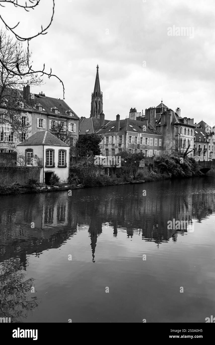 Cityscape view from the beautiful city of Metz in France. Bridges, houses and churches on the bank of the Moselle River. Stock Photo