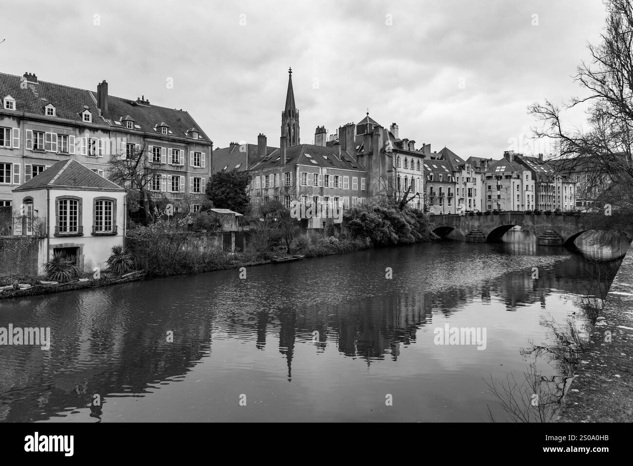 Cityscape view from the beautiful city of Metz in France. Bridges, houses and churches on the bank of the Moselle River. Stock Photo