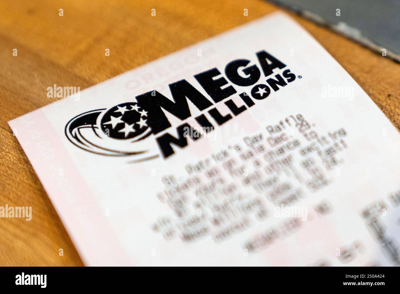 A Mega Millions lottery ticket is displayed at a store on Thursday, Dec
