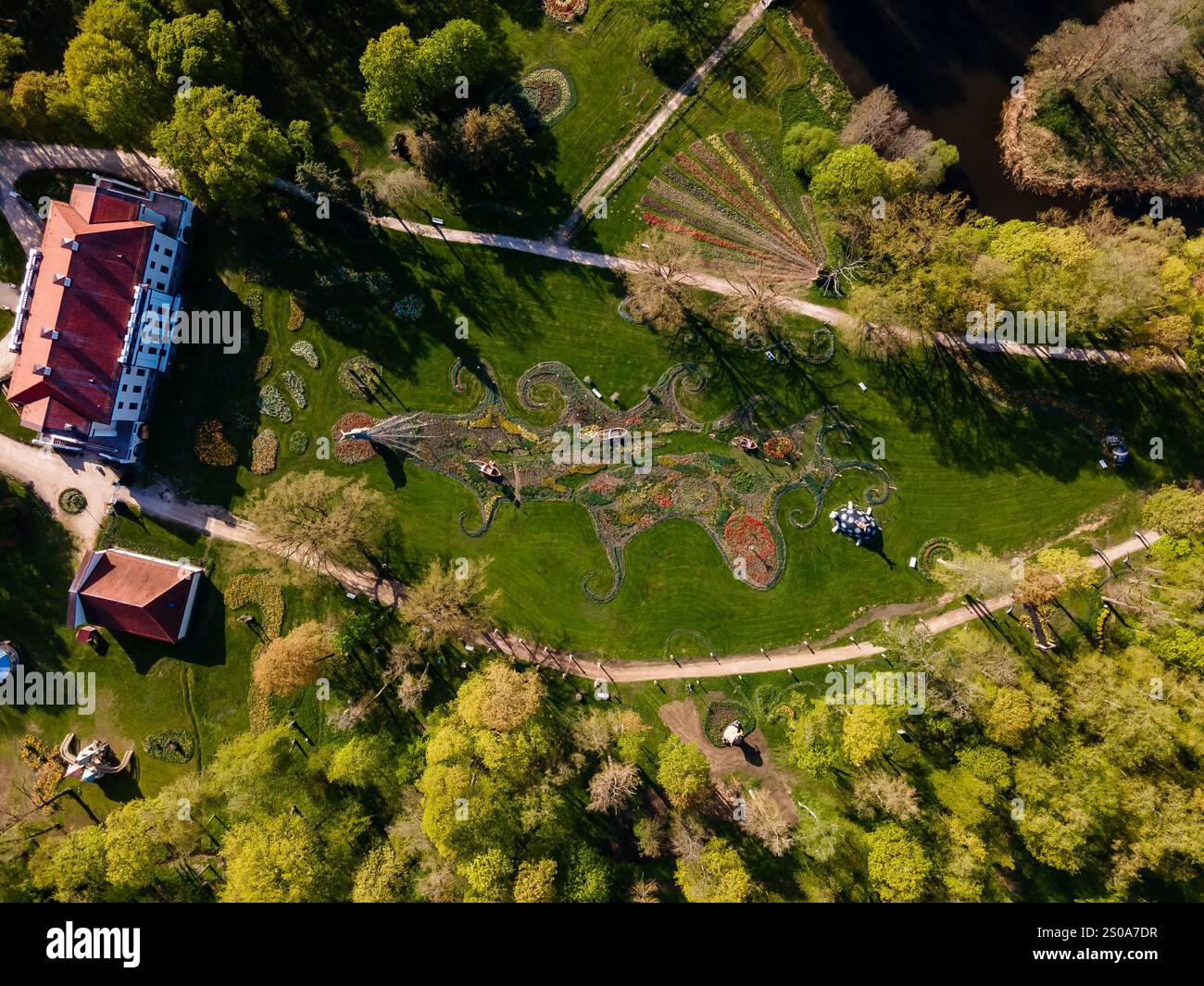 Pakruojis Manor in Lithuania is seen from above, surrounded by vibrant ...