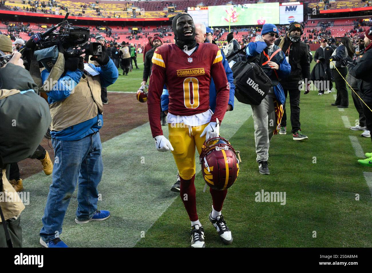 Washington Commanders cornerback Mike Sainristil (0) reacts after an