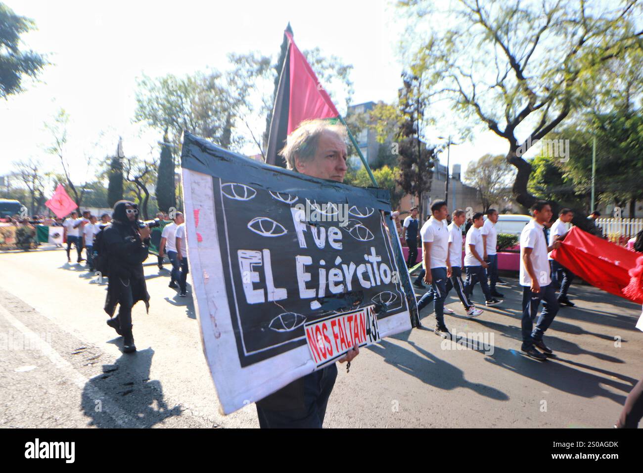 Mexico City, Mexico. 26th Dec, 2024. A person taking part during a demonstration for the 43 missing students from Ayotzinapa from the Glorieta de Peralvillo to the Basilica of Guadalupe. on December 26, 2024 in Mexico City, Mexico. (Photo by Carlos Santiago/ Credit: Eyepix Group/Alamy Live News Stock Photo