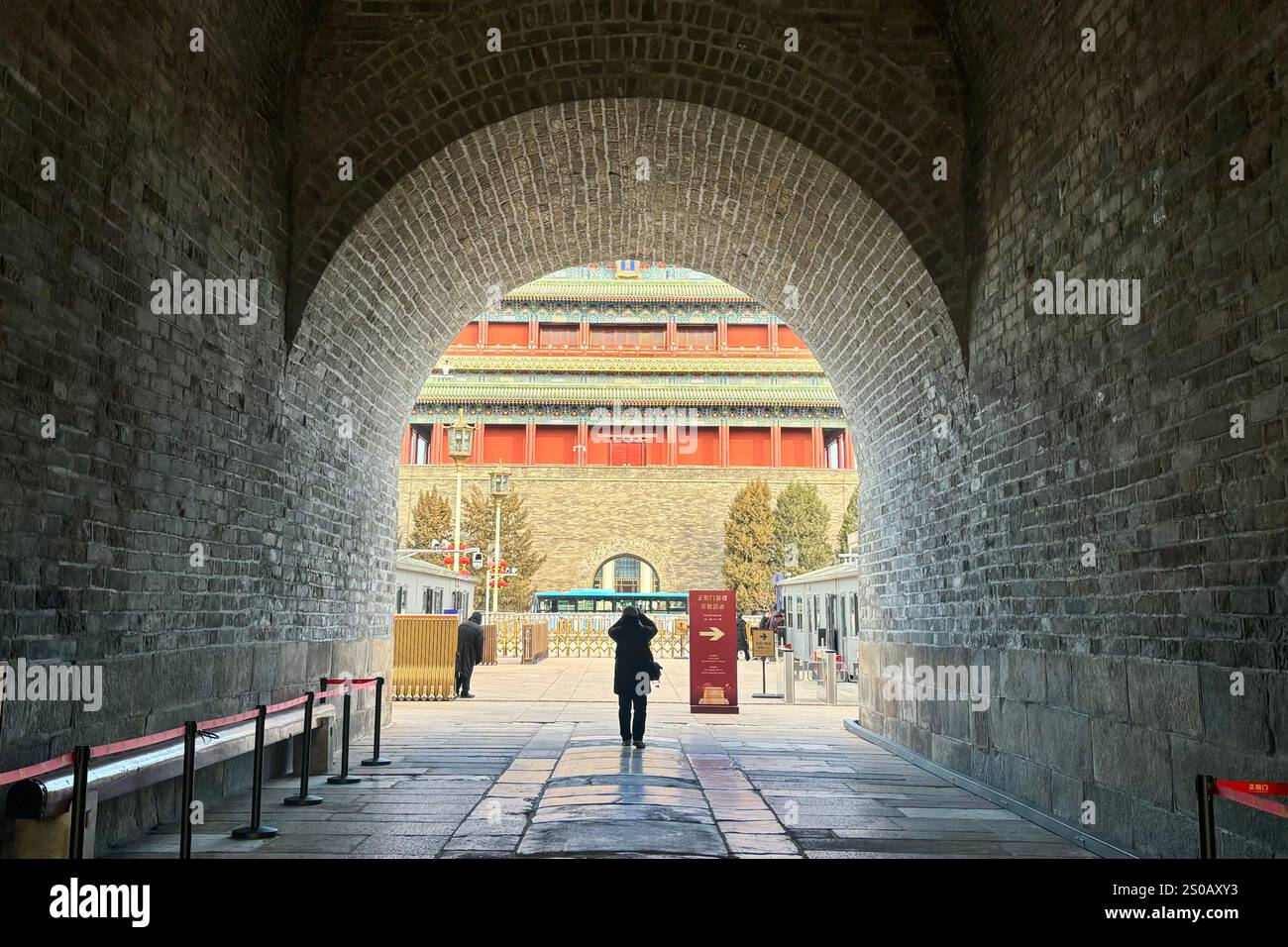 Beijing,China.26th December 2024. A visitor takes a photo of the Zhengyangmen Gate Tower on December 26, 2024 in Beijing, China. Dating back to the Ming Dynasty (1368-1644), the Zhengyangmen Archery Tower, located along Beijing's central axis, opened to the public on December 26. Credit: Xu Jing/China News Service/Alamy Live News Stock Photo