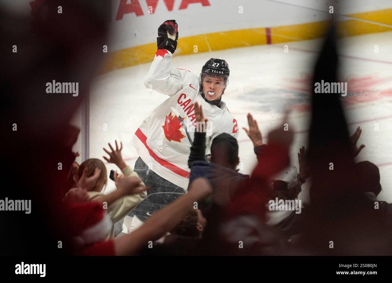 Canada forward Easton Cowan (27) celebrates after his goal against