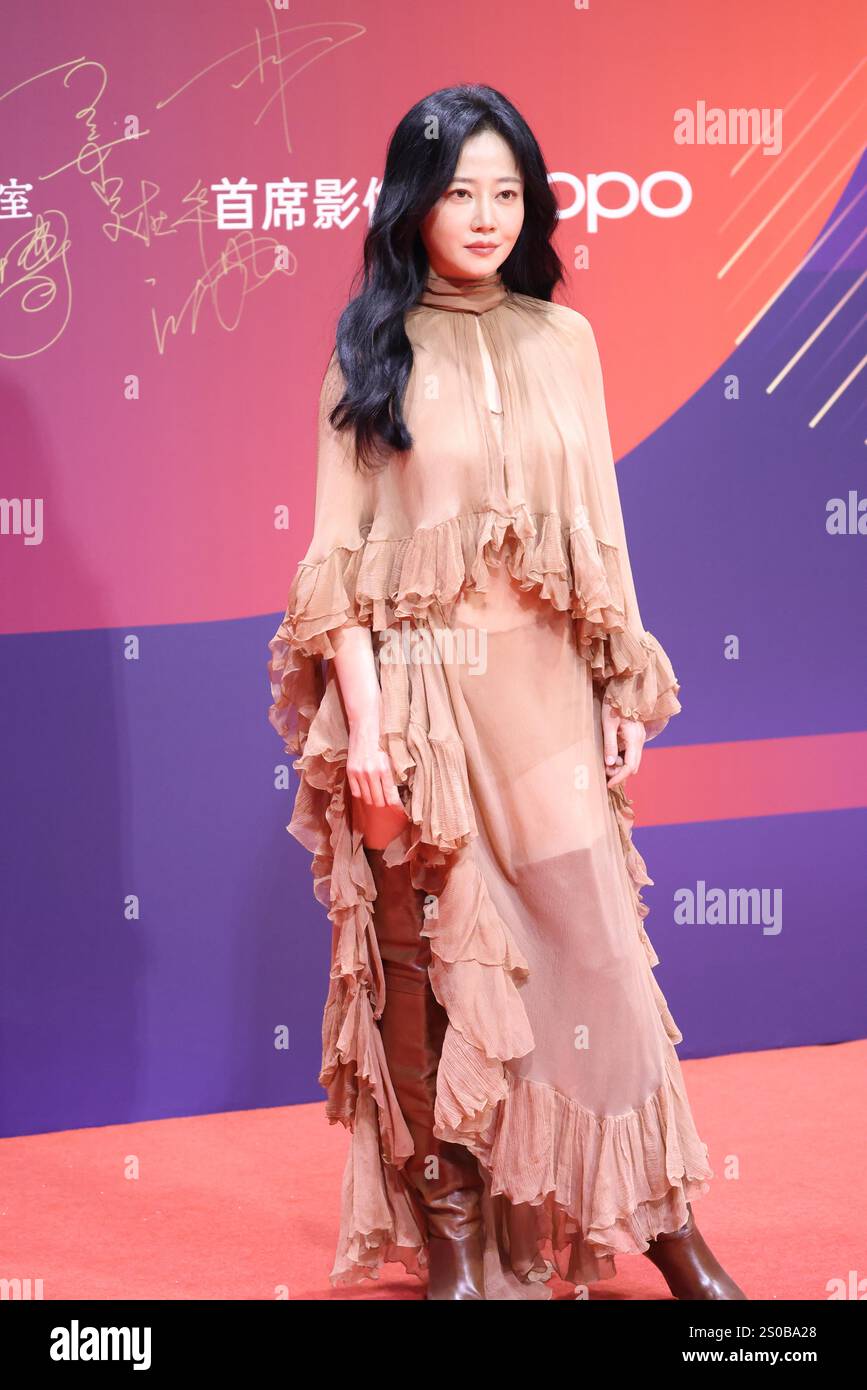 Chinese television and film actress Tan Zhuo attends an activity in