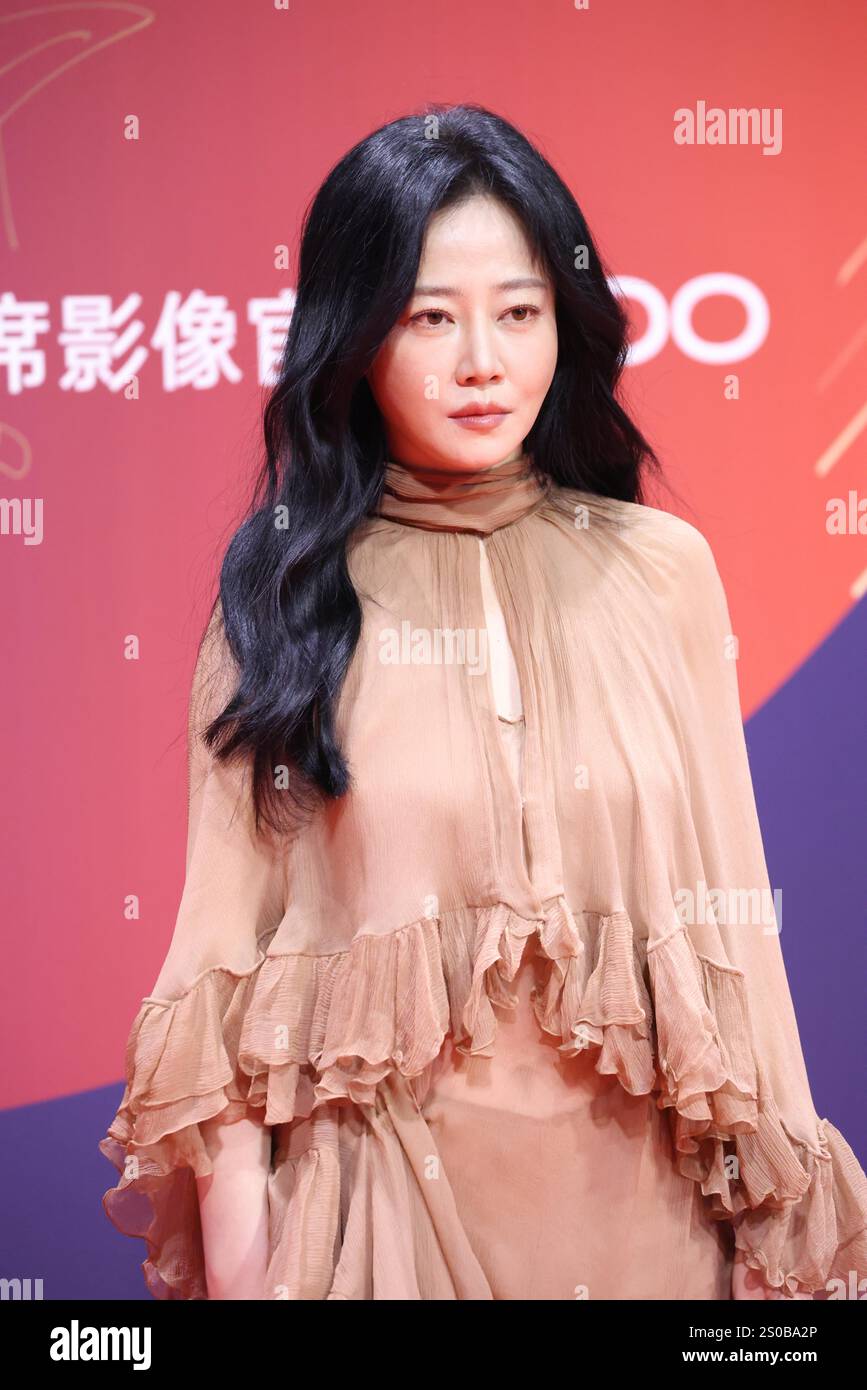 Chinese television and film actress Tan Zhuo attends an activity in