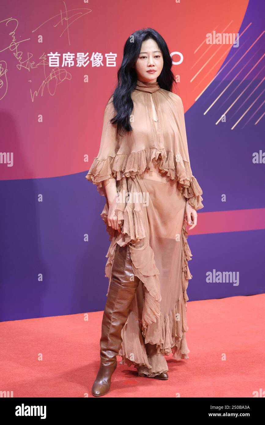 Chinese television and film actress Tan Zhuo attends an activity in