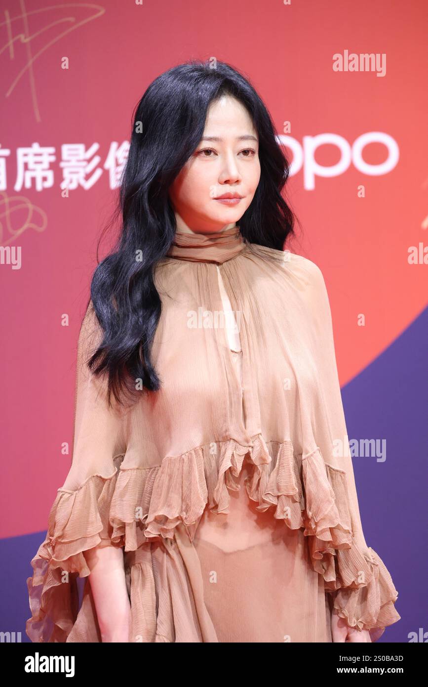 Chinese television and film actress Tan Zhuo attends an activity in