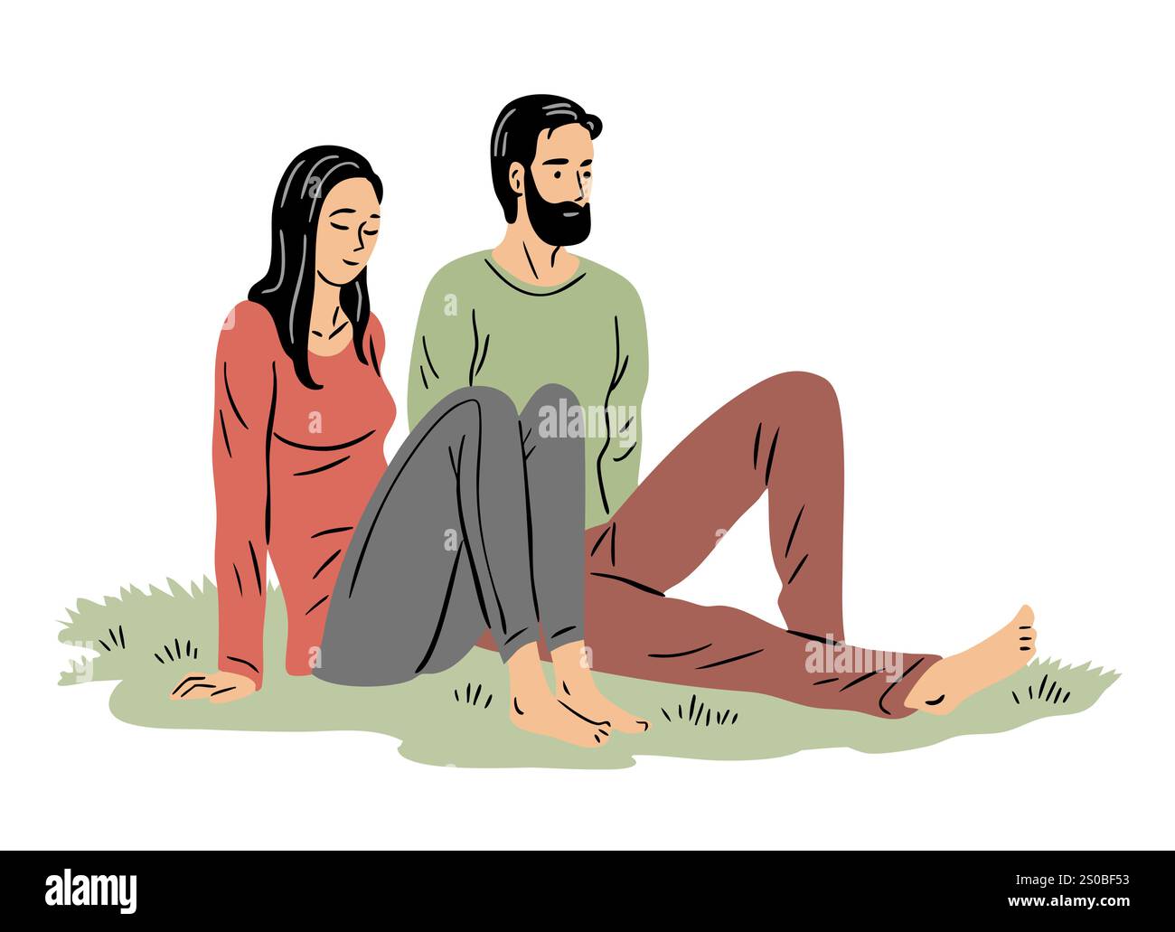 A young couple is relaxing in nature. Man and girl sitting on the grass ...