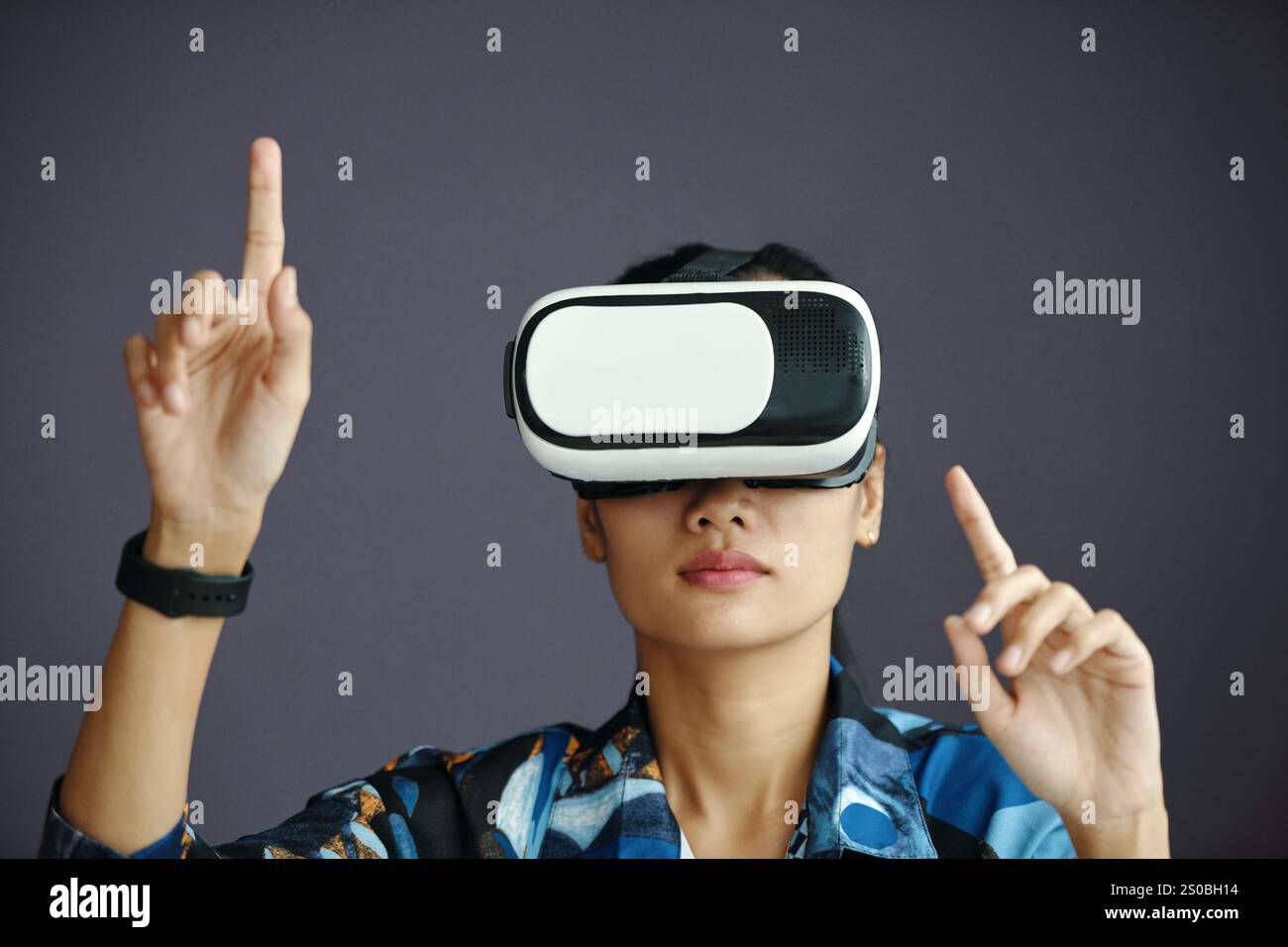 Asian Woman Using VR Headset Stock Photo