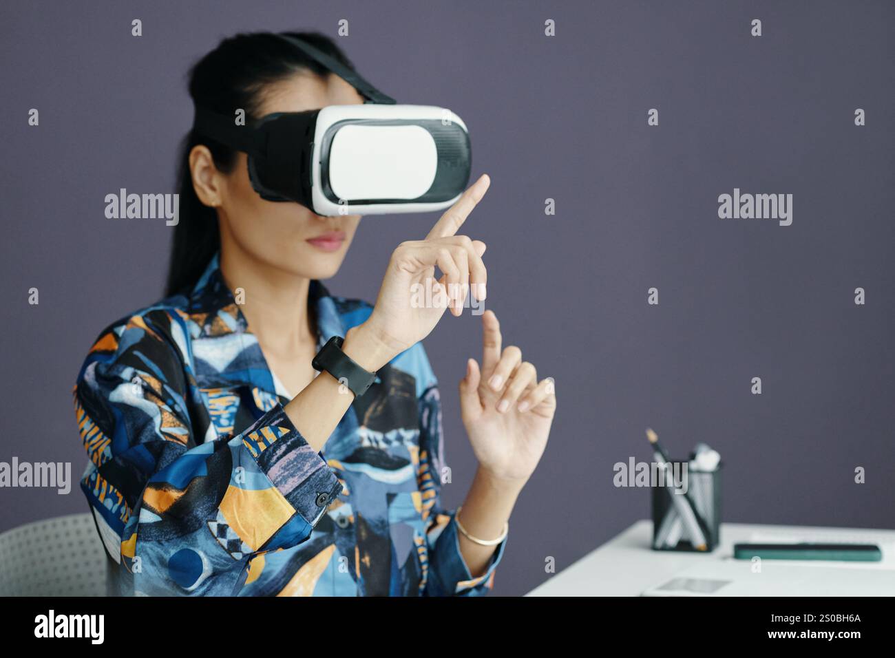 Young Office Worker Using VR Technology Stock Photo