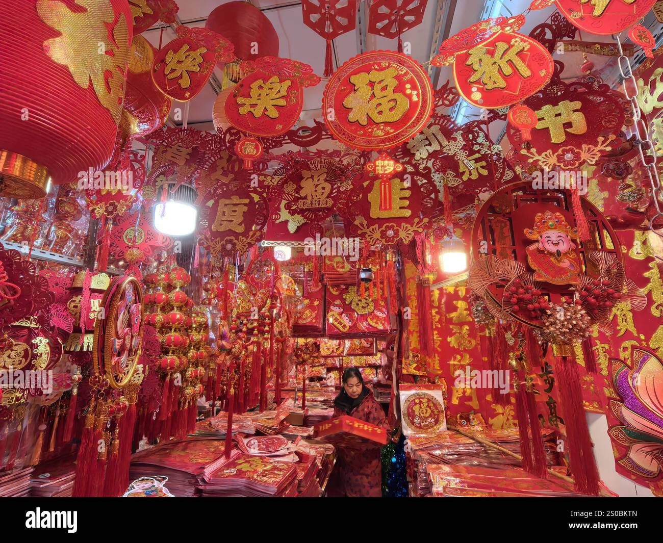 People shop Spring Festival goods at a market in Nanjing City, east
