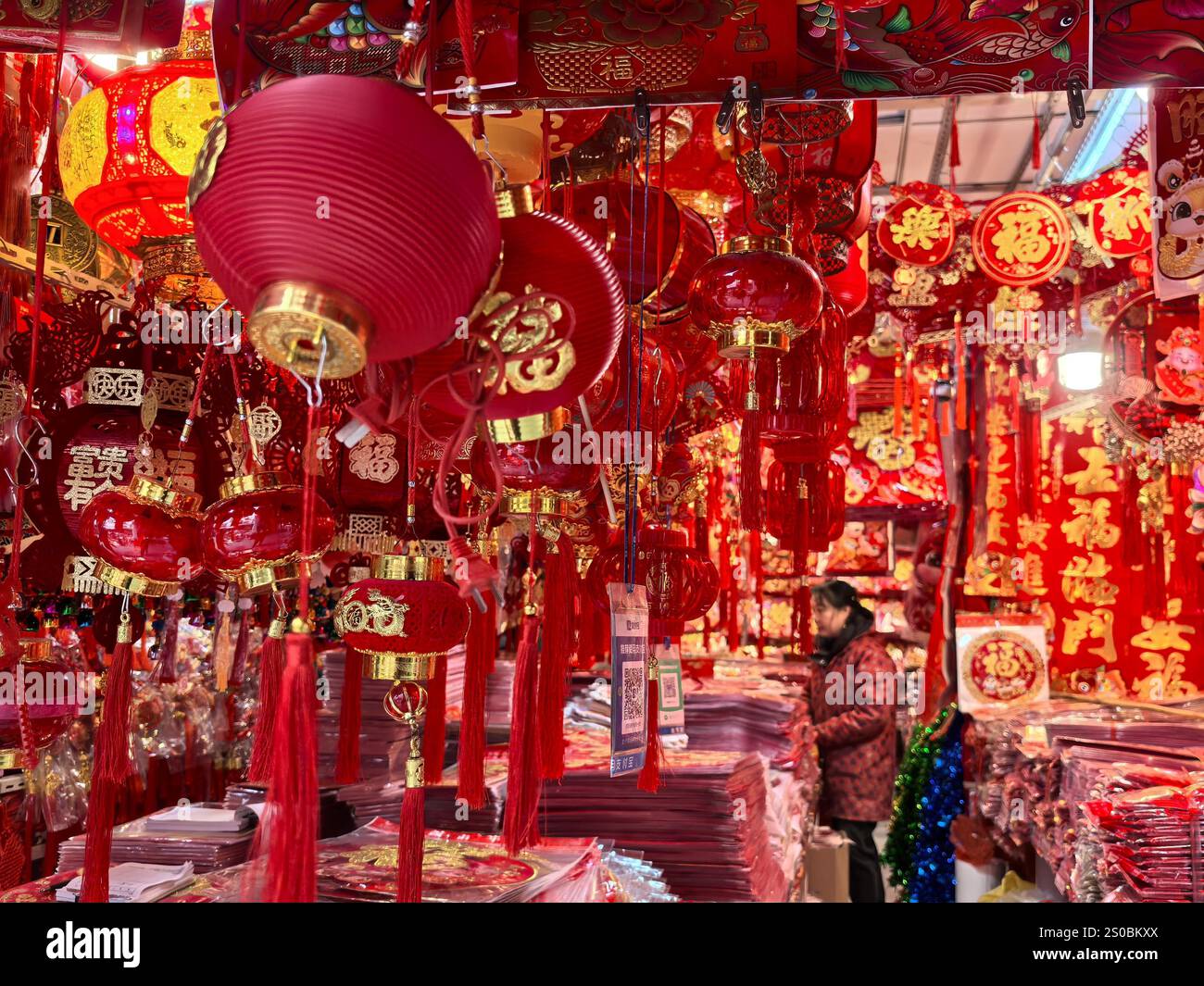 People shop Spring Festival goods at a market in Nanjing City, east